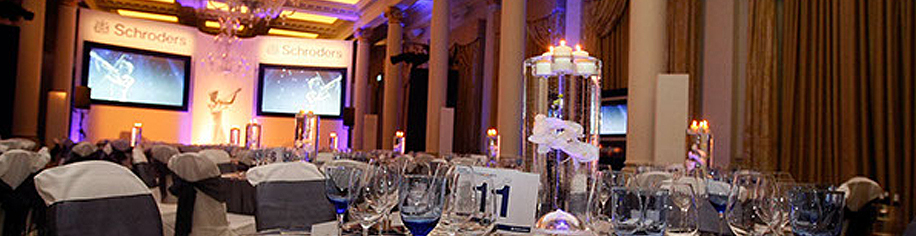 Dressed awards dinner hall with glass floating centre piece